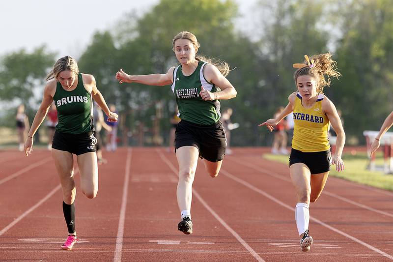 West Carroll’s Emma Randecker takes second in the 100-meter dash Wednesday, May 10, 2023 at the class 1A Erie girls track sectional.