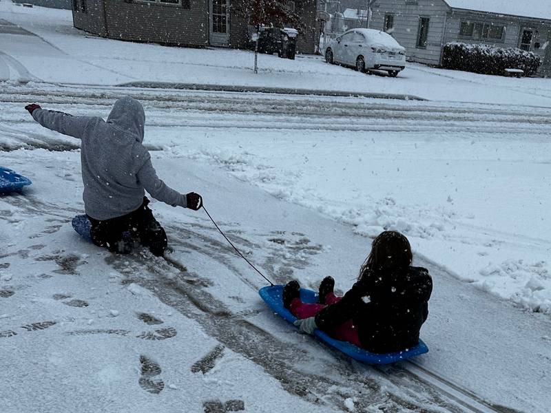 Sisters Lilly, 11, and Libby, 7, Tarbill, playing outside Tuesday morning, Jan. 9, 2024, enjoying a snow day from school in Sterling.