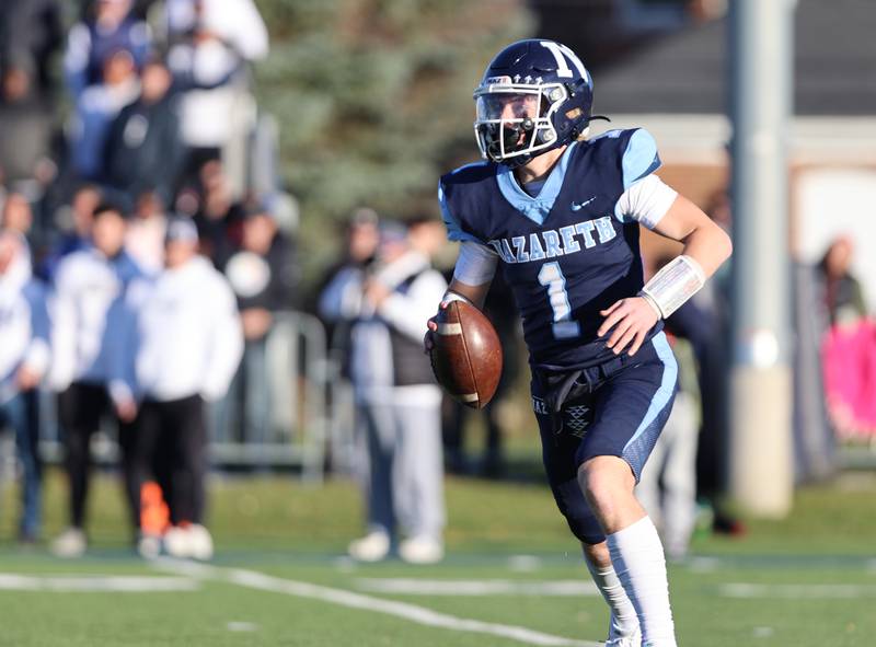 Nazareth's Logan Malachuk (1) looks for a receiver against St. Francis during the boys varsity IHSA 5A semifinal between Nazareth Academy and St. Francis high school in La Grange Park, IL on Saturday, Nov. 18, 2023.