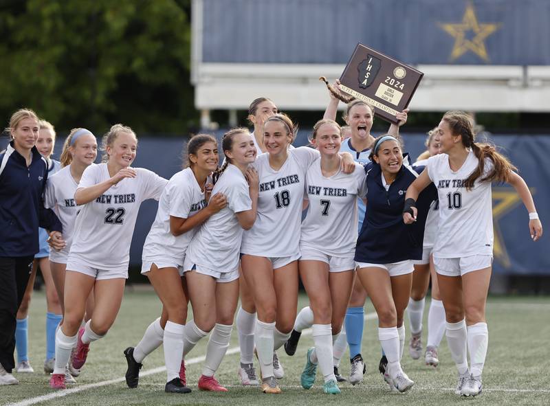 New Trier celebrates winning the Class 3A Dominican super-sectional against Lyons Township in River Forest on Tuesday, May 28, 2024.