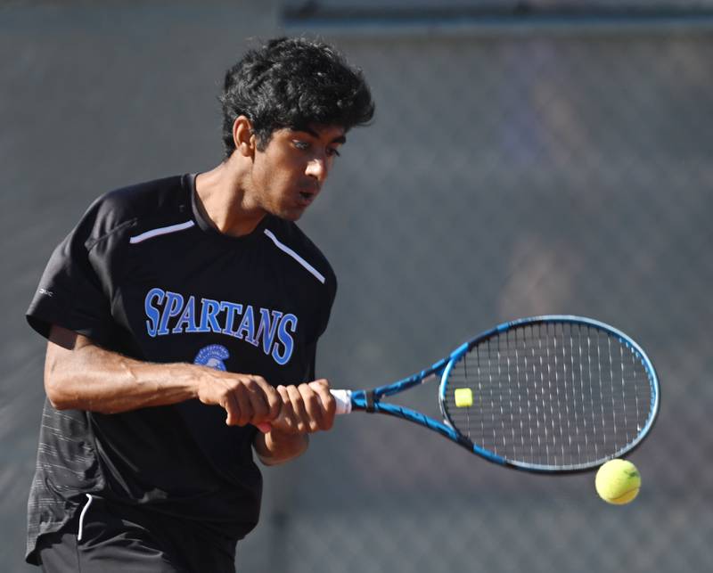 Umar Bajwa of St. Francis returns the ball during the Class 1A singles consolation semifinal of the boys state tennis tournament at Palatine High School on Saturday, May 25, 2024 in Palatine.