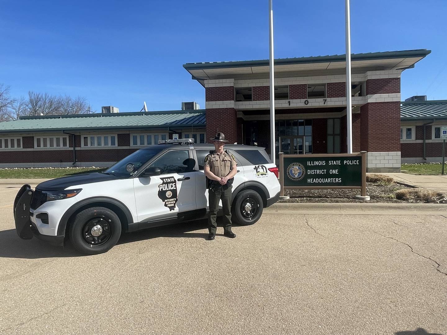 Illinois State Police Trooper Josh Vos was assigned District 1's commemorative 100th anniversary squad car. Each of the 21 state police districts were assigned one of the cars, whose design reflects the classic black and whites used by the patrol in the 1950s.