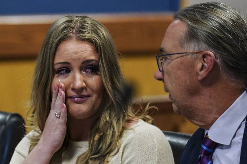 FILE - Jenna Ellis speaks with her attorney Franklin Hogue after Ellis plead guilty to a felony count of aiding and abetting false statements and writings, Oct. 24, 2023, inside Fulton Superior Court Judge Scott McAfee's Fulton County, Ga., courtroom in Atlanta. (AP Photo/John Bazemore, Pool, File)