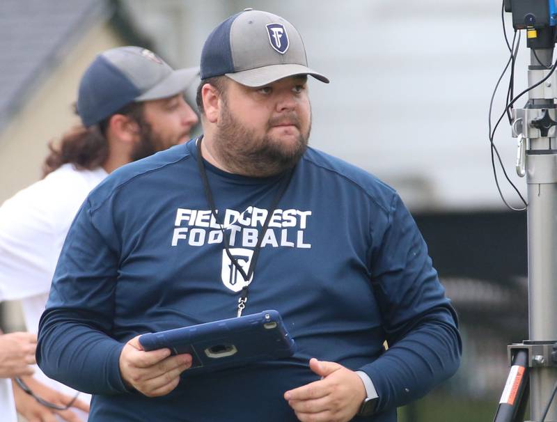 Fieldcrest head football coach Nick Meyer observes practice on Monday, July 8, 2024 at Fieldcrest High School.