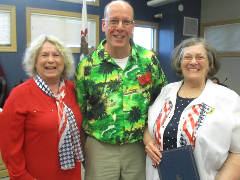 Yorkville Mayor John Purcell wears a bright red poppy on his shirt and declares May 8-14 to be Poppy Awareness Days in Yorkville. He is seen here with Yorkville American Legion Post 489 Auxiliary members Diane Dillow, left, and Joanne Leibold on April 25, 2023.