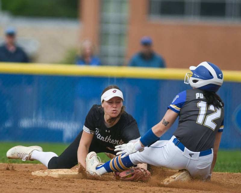 Glenbard North's Tru Medina, left, tags out Wheaton North's Macy Pomatto (12) at second base during the game on Monday May 13, 2024, held at Wheaton North High School.