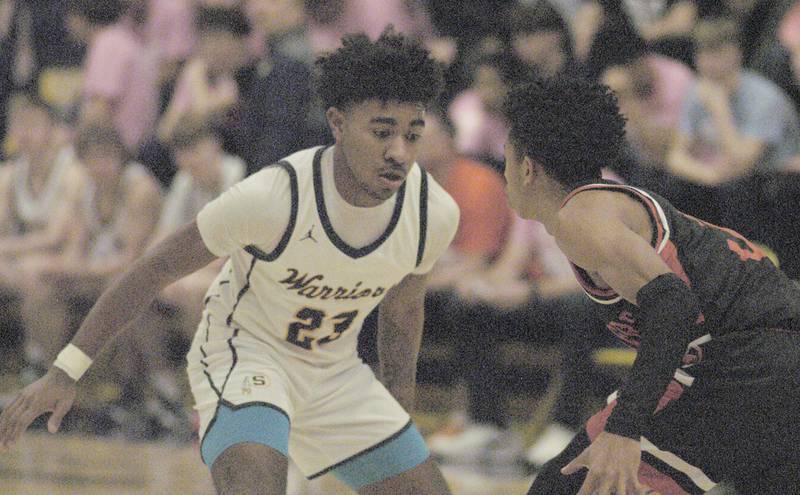 Sterling  player Kaedon Phillips  applies defensive pressure to United Township's Dominic Rhoden during their game Friday, Feb. 9, 2024 at Sterling High School