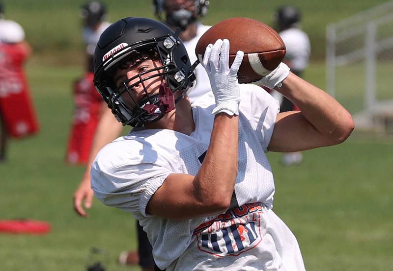 Sycamore’s Colton Sharpness makes a catch Monday, July 15, 2024, during summer football camp at Sycamore High School.