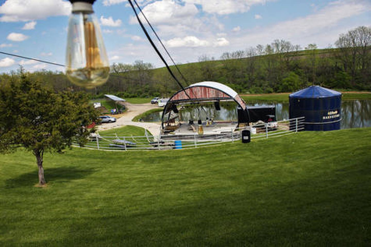 Rhythm Section Amphitheater’s stage is nestled among the rolling hills of Carroll County, about a mile north of Mount Carroll. With a lake as its backdrop, the stage is set for a performance experience unlike any other.