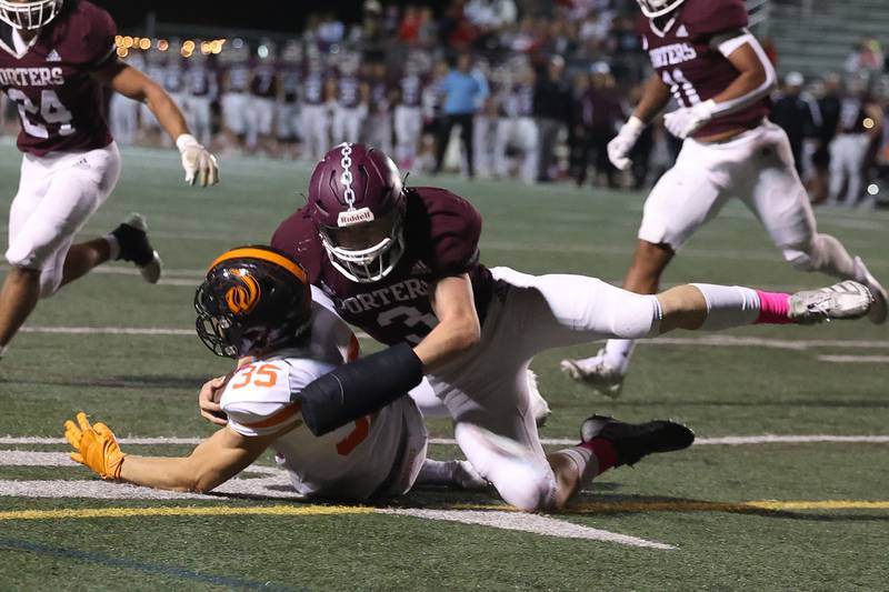 Lockport’s Colton Benaitis brings down the Lincoln-Way West punter to set up the Porters in the redzone on Friday, Oct. 18, 2024 in Lockport.