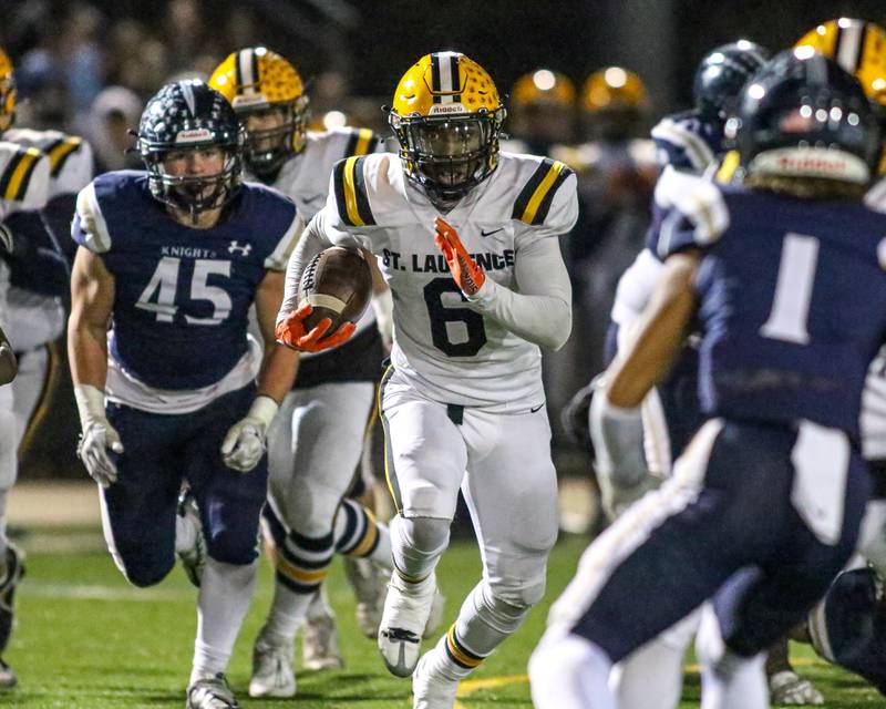 St Laurence's Aaron Ball (6) runs up the middle during Class 4A third round playoff football game between St Laurence at IC Catholic Prep.  Nov 11, 2023.