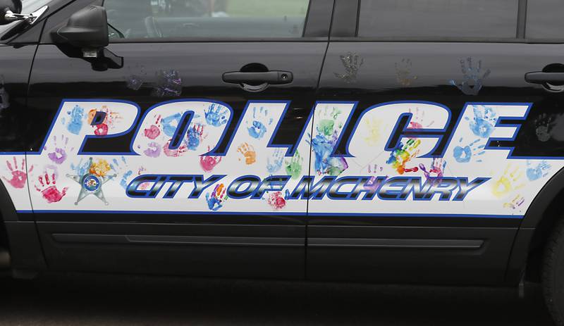 Hand prints are displayed on a McHenry Police Department squad car the during a National Night Out event Tuesday, Aug. 6, 2024, at Petersen Park in McHenry.