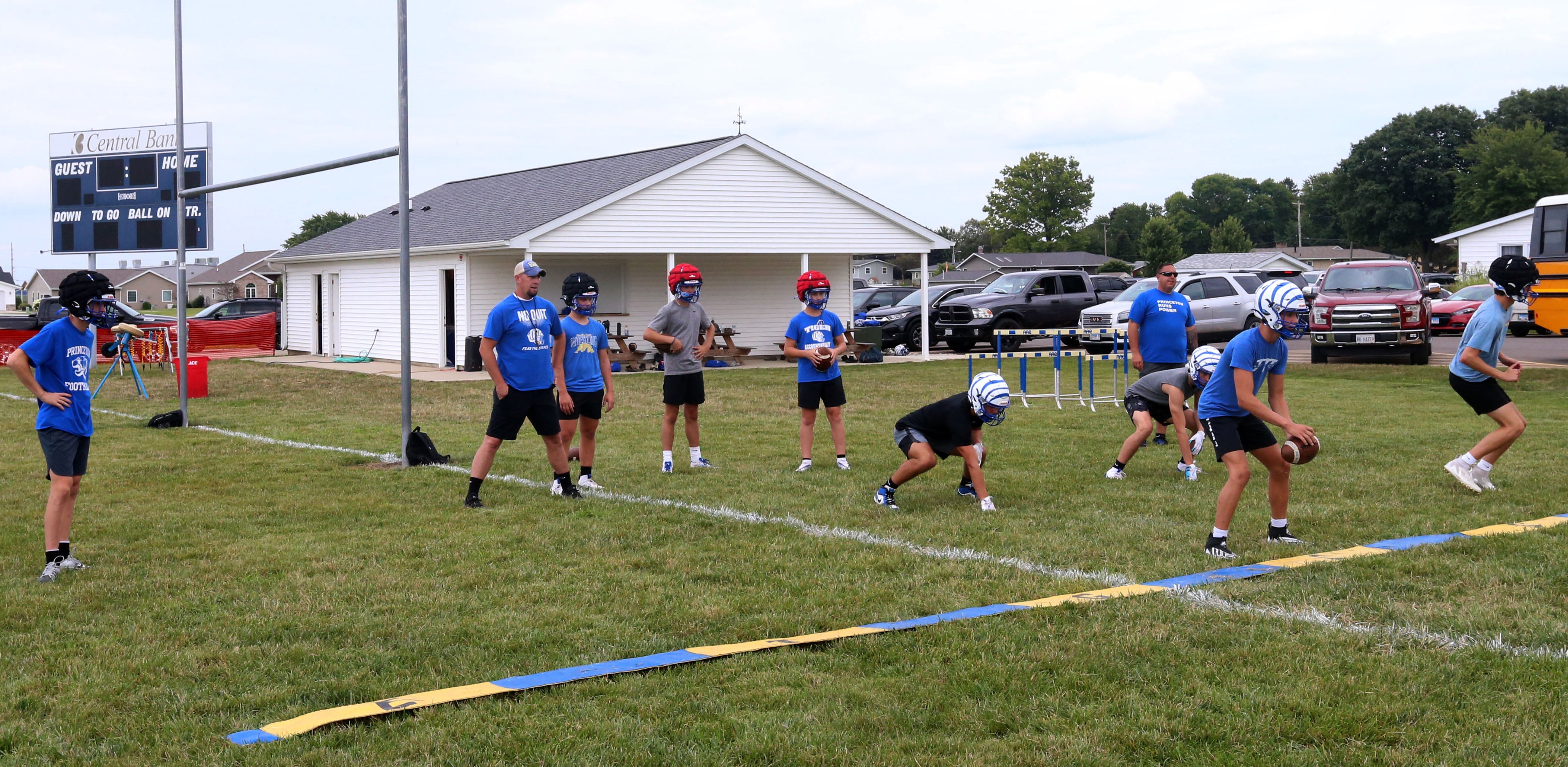 Members of the Princeton football team run drills during the first day of football practice on Monday, Aug. 12, 2024 at Little Siberia Field in Princeton.