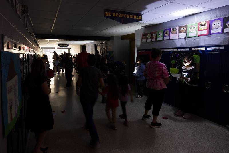 Parents and friends filed through Sterling's Washington School hallways on Thursday, May 16, 2024, where third-graders waited to talk about their research in a wax museum-esque style.