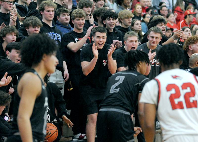 Oswego East's Mason Lockett IV takes flak from the Yorkville fans after turning over the ball during a varsity basketball game at Yorkville High School on Friday, Feb. 9, 2024.