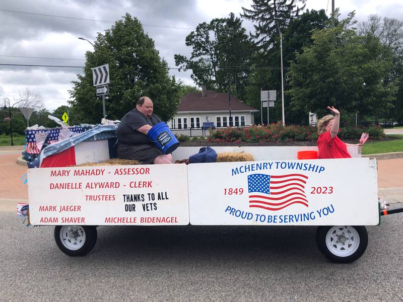 The McHenry Township float goes around the Chapel Hill/ Johnsburg Road roundabout during the Johnsburg Memorial Day parade Monday May 27, 2024.