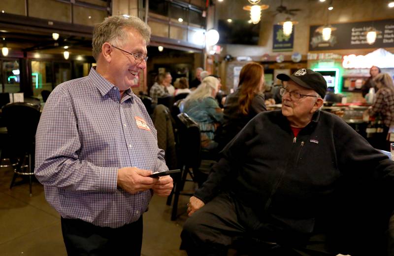 Kane County Board District 12 Republican incumbent Bill Roth (left) and District 16 incumbent Mike Kenyon await  election results at Old Towne Pub and Eatery in Campton Hills on Tuesday, March 19, 2024.