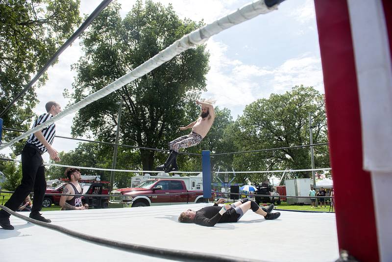 Heels and heroes duked it out during a ZOWA wrestling event Saturday, August 13, 2022 at the Carroll County fair in Milledgeville.