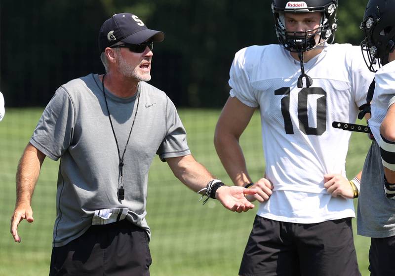 Sycamore head coach Joe Ryan gives some instruction Monday, July 15, 2024, during summer football camp at Sycamore High School.