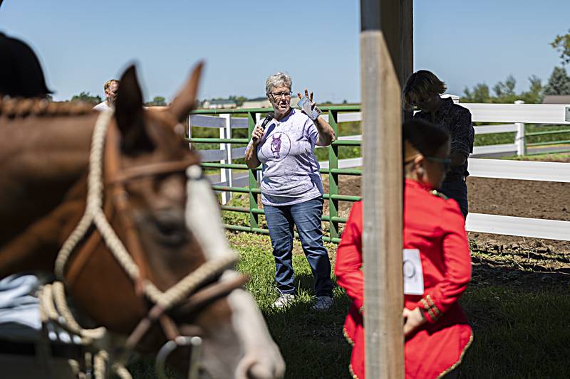 Bryan Hollewell dedicates a newly constructed seating pavilion in the name of long time horse competition supporter Charlotte Rahn Saturday, August 12, 2023 at the Carroll County Fair. The pavilion will offer a shaded place for watching the competitions and handing out of awards.