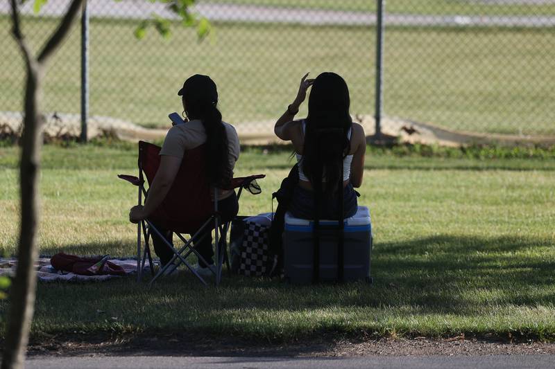 Several ladies grab a spot early before the fireworks at Dellwood Park in Lockport on Wednesday July 3, 2024.