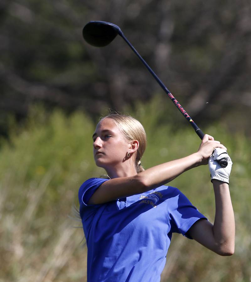 Johnsburg’s Addison Sweetwood watches her tee shot on the 8th hole of the Prairie course during the McHenry County Tournament on Thursday, Sept.12, 2024, at Boone Creek Golf Club in Bull Valley.