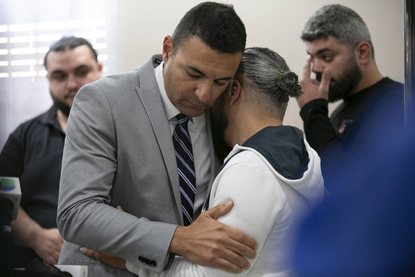 Ahmed Rehab, left, executive director of the Chicago chapter of the Council on American-Islamic Relations,  embraces Odey Al-Fayoume, father of Wadea Al-Fayoume, 6, at a news conference at the Muslim Community Center on Chicago's Northwest Side, Sunday, Oct. 15, 2023. Authorities say a 71-year-old Illinois man has been charged with a hate crime, accused of fatally stabbing a 6-year-old boy and seriously wounding a 32-year-old woman, in Plainfield Township, because of their Islamic faith and the Israel-Hamas war. The Council on American-Islamic Relations identified the victims as Wadea Al-Fayoume and his mother.