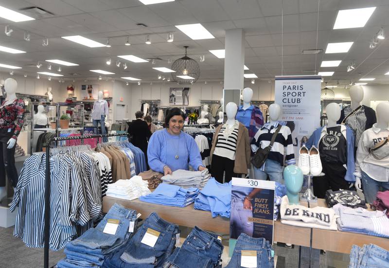 Olivia Smith, the manager of Maurices, stands by some of the clothing items for sale on Thursday, Feb. 8, 2024. The new store opened Feb. 2, 2024 at Sterling Crossing, across from their former location in the Northland Mall.