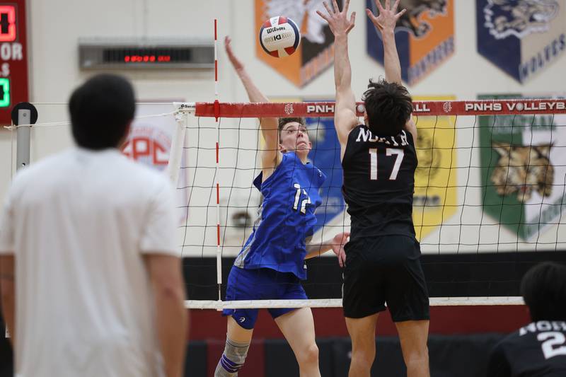 Lincoln-Way East’s Drew Clarkin hits a shot against Plainfield North on Tuesday, April 2, 2024.