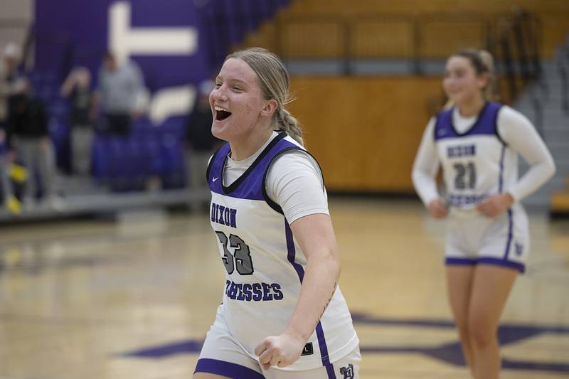 Dixon’s Jessie Pitman celebrates with Dixon fans after their win over Sterling Tuesday, Feb. 13, 2024 during a regional semifinal at Rochelle.