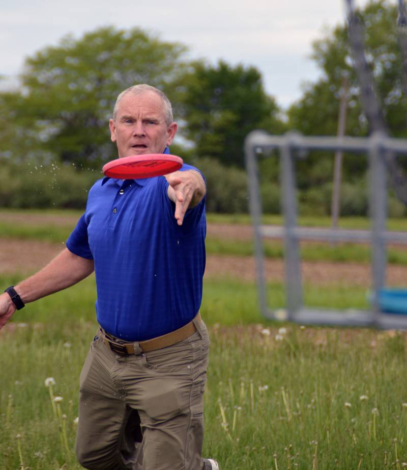 Wes Black prepares to sink a second putt on Illinois Valley Community College’s disc golf course recently. Area disc golfers can thank Black for the challenges he creates for them in his course layouts, but his name has also become synonymous with the sport as a promoter of the activity and an avid player.