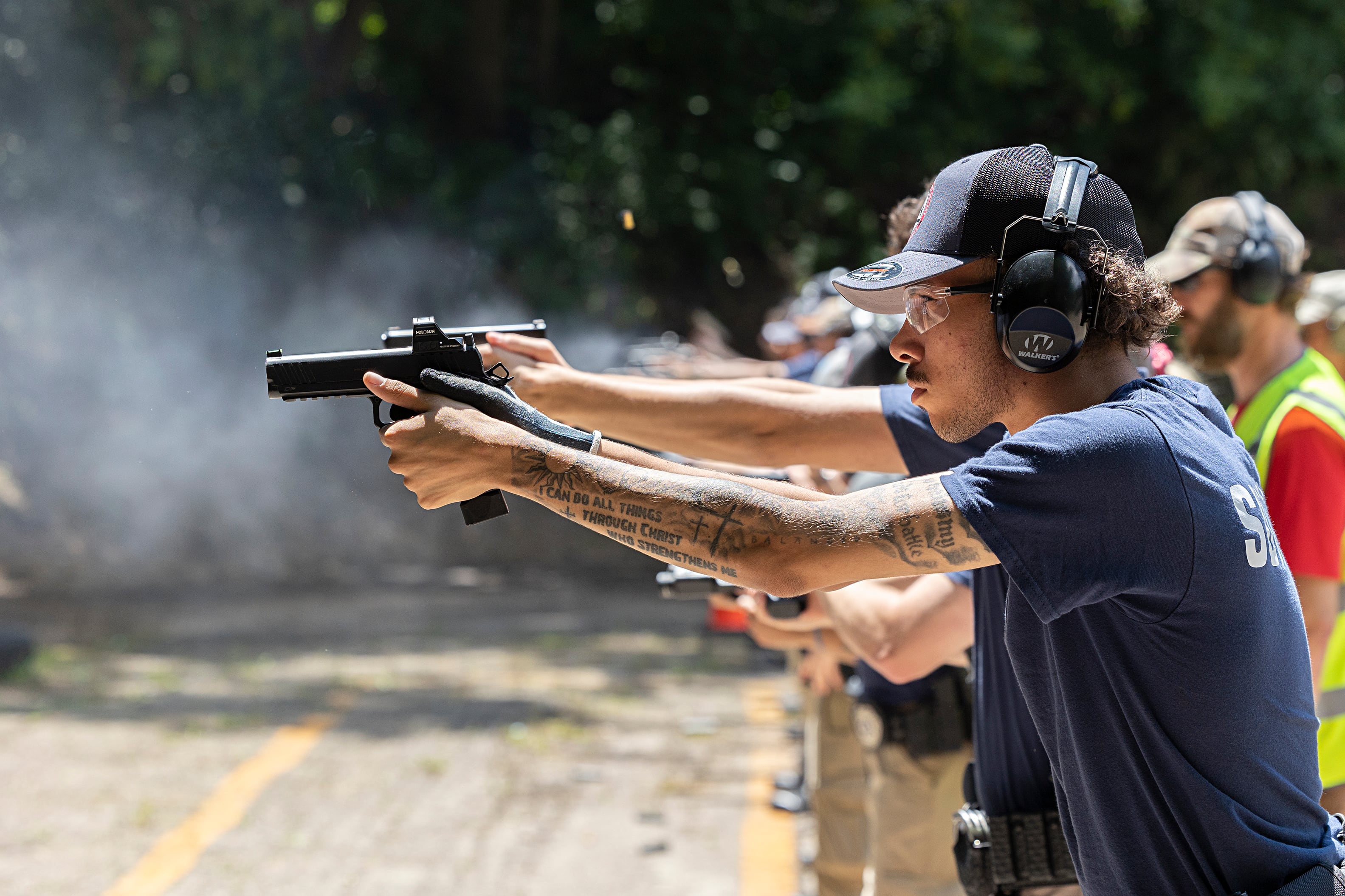 Damion Summers takes aim during range training Wednesday, July 17, 2024, through the Sauk Valley Police Academy.