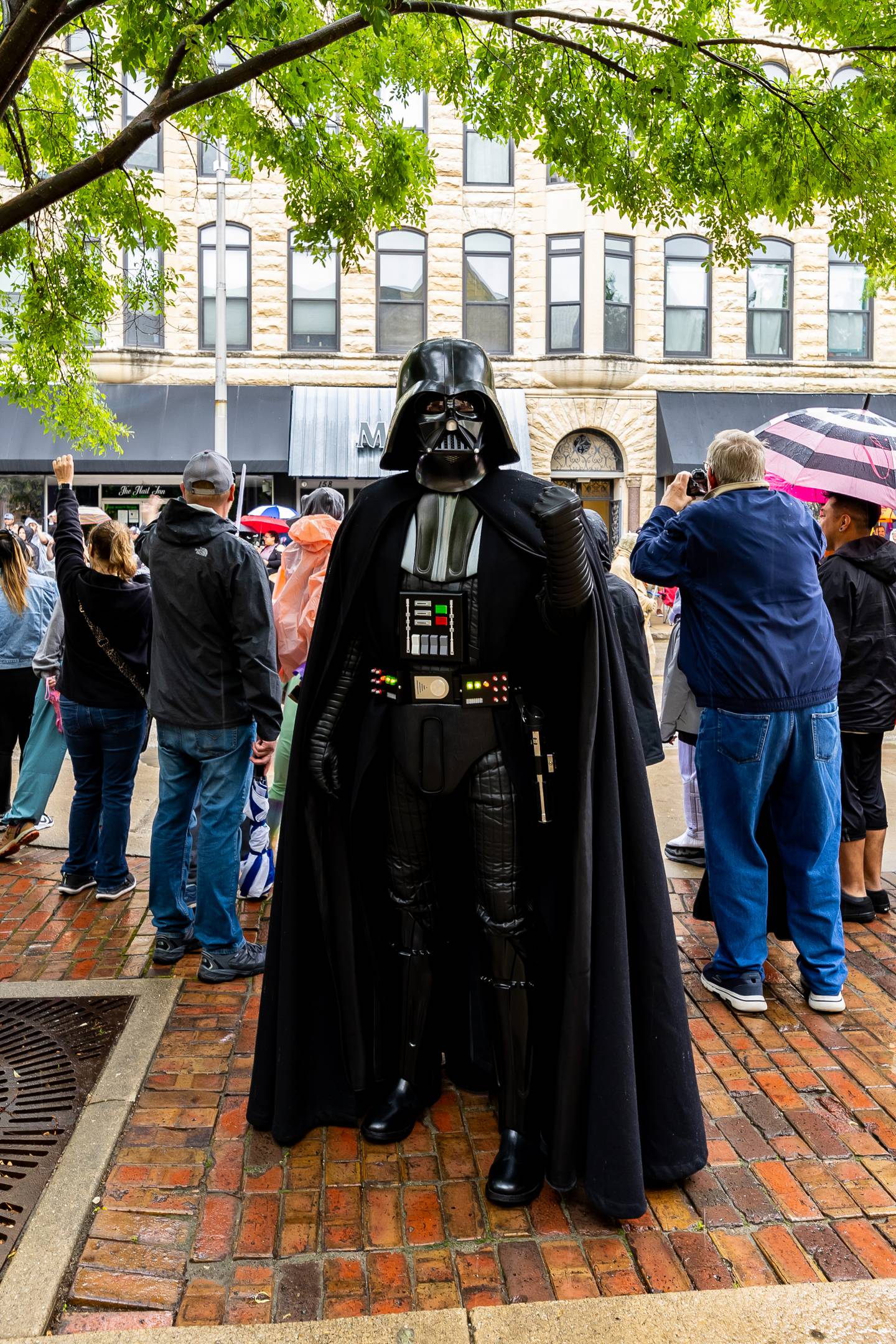 Darth Vader, AKA Scott Omachinski of the Midwest Garrison Chapter of the 501st Legion, stops for a photo during Joliet Public Library's Star Wars Day Parade on June 1, 2024.