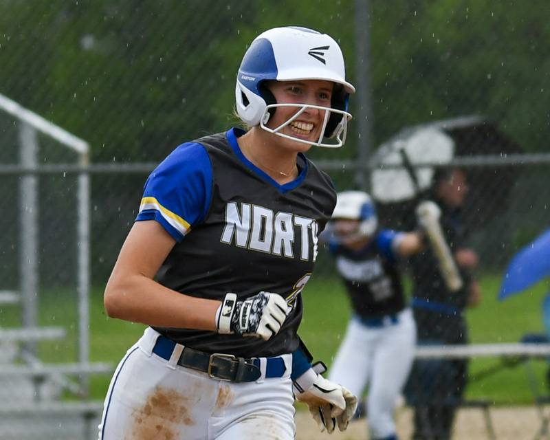 Wheaton North's Reagan Crosthwaite (21) is all smiles after hitting a home run during the game on Monday May 13, 2024, while taking on Glenbard North High School.