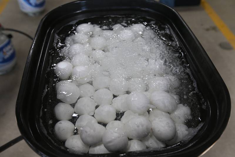 Hard boiled eggs bubble in a roster pan on Friday, March 29, 2024, at the Utica Fire Station for the department's annual Easter Egg Hunt. The hunt takes place 11 a.m. Saturday, March 29, in Carey Memorial Park in Utica. The Utica Fire Department has been featuring hard boiled eggs for its hunts since the 1970s.