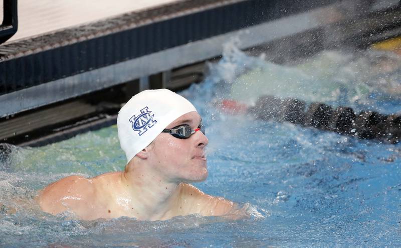 Brady Johnson of West Chicago looks at his time after competing in the Boys 50 Yard Freestyle during the IHSA Boys state swim finals Saturday February 25, 2023 in Westmont.