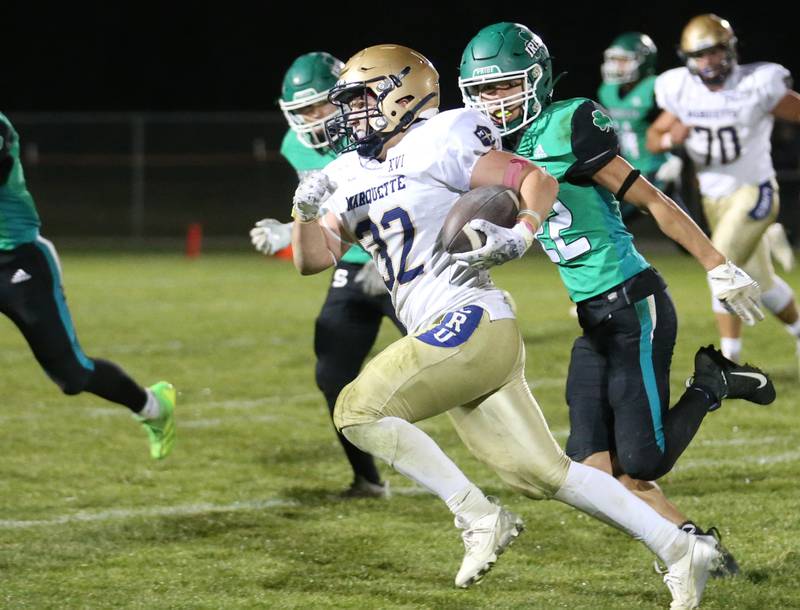 Marquette's Grand Dose runs the ball down the field against Seneca on Friday, Oct. 18, 2024 at Seneca High School.