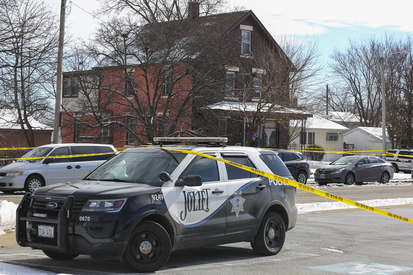 A squad car blocks traffic at the intersection of Ingalls Ave. and Nicholson St. after an officer involved shooting that took place on Thursday, Jan. 28, 2021, in Joliet, Ill.