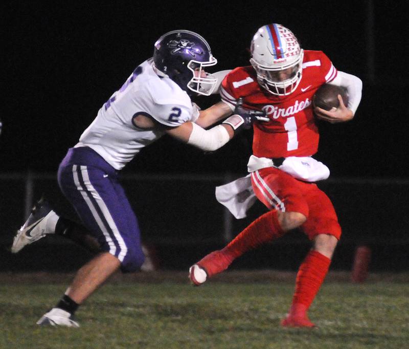 Rochelle's Jack Pavlak tackles Ottawa's Mark Munson at King Field on Friday, Oct. 18, 2024.