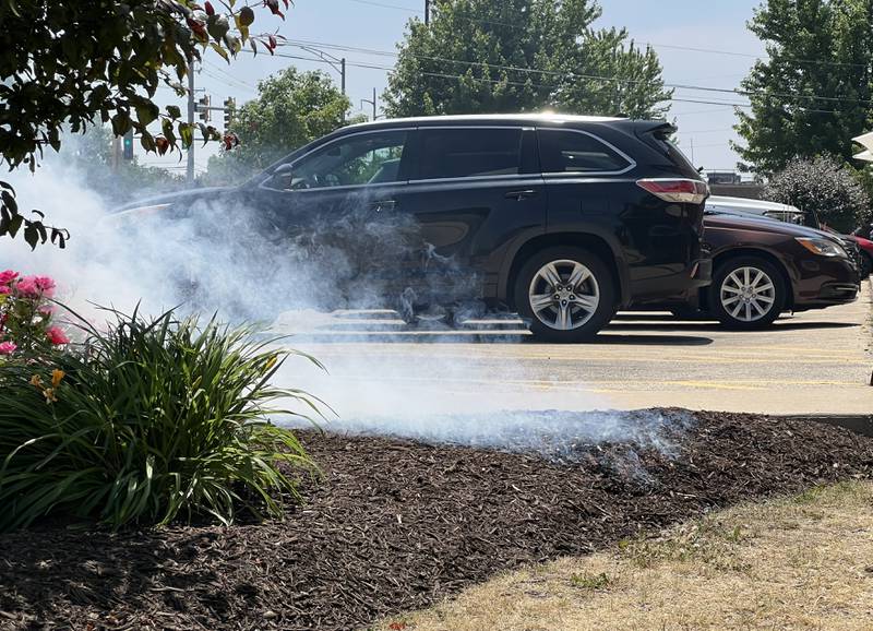 The mulch in front of Field Dental in DeKalb smokes and smolders on June 9, 2023. A DeKalb Fire Department official said, postulated the fire was a result of a still lit cigarette butt and dry conditions, but said the small blaze won't be further investigated.