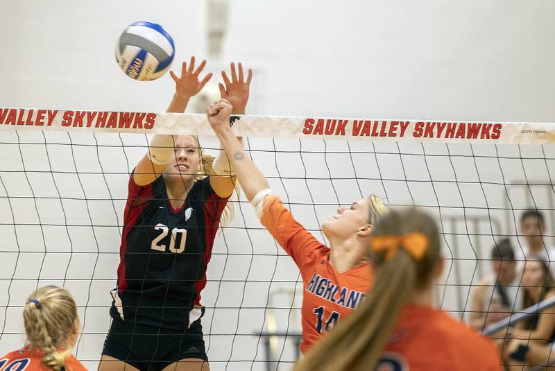 Sauk Valley’s Lacey Eissens goes up for a block against Highland’s Emma Miller Tuesday, Sept. 17, 2024.