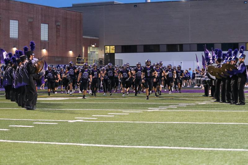 Downers Grove North takes the field before football game between Glenbard West at Downers Grove North on Friday, Sept 13th, 2024  in Downers Grove.