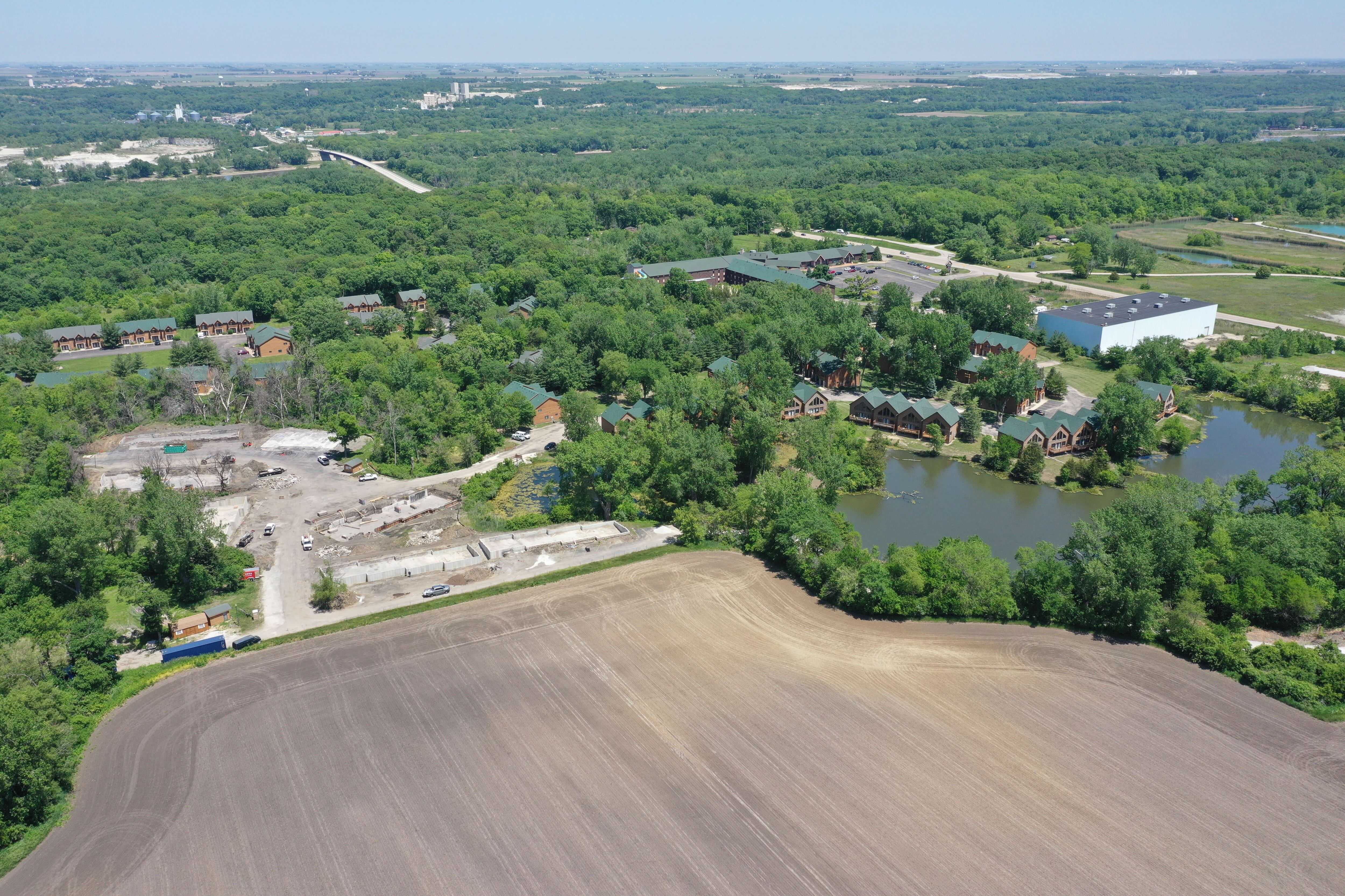 An aerial view of the site where a major fire broke out one year earlier Grand Bear Resort at Starved Rock. Foundations have been poured and crews are beginning to rebuild after the fire.