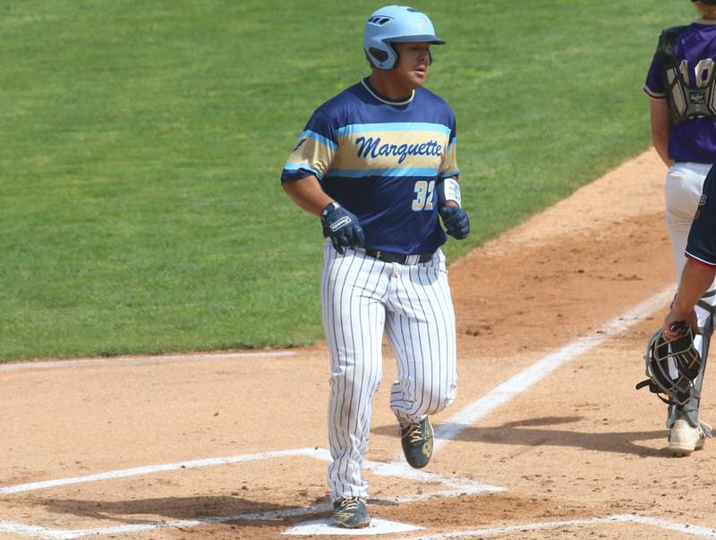 Marquette's David Clairmont scores a run against Routt during the Class 1A semifinal game on Friday, May 31, 2024 at Dozer Park in Peoria.