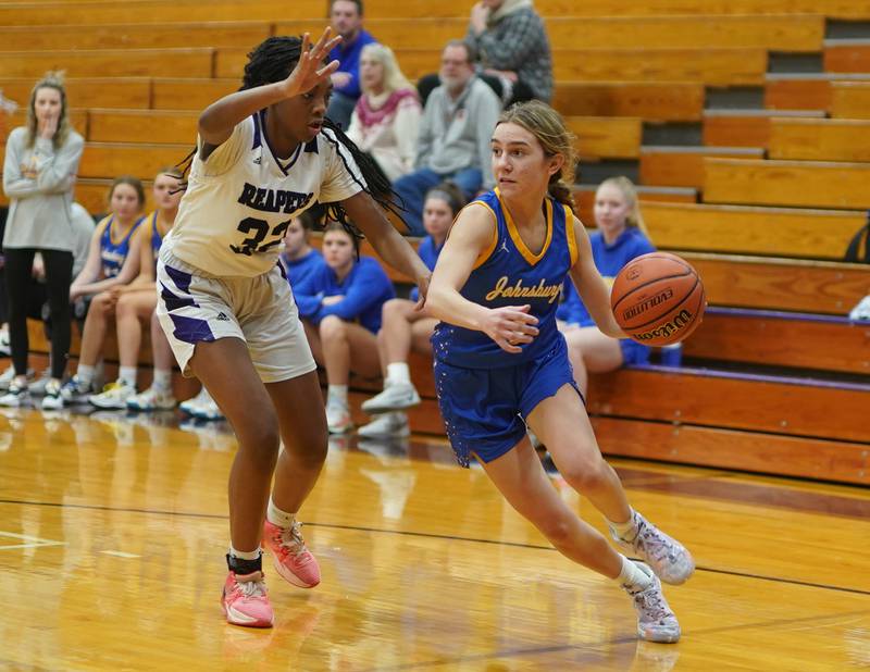 Johnsburg's Ava Jablonski (1) drives the baseline against Plano's Nylah Mathews (32) during a basketball game at Plano High School on Tuesday, Jan 30, 2024.