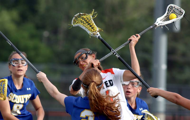 Crystal Lake Central’s Addison Bechler scores her third goal of the game against Lake Forest during girls lacrosse supersectional action at Metcalf Field on the campus of Crystal Lake Central Tuesday.