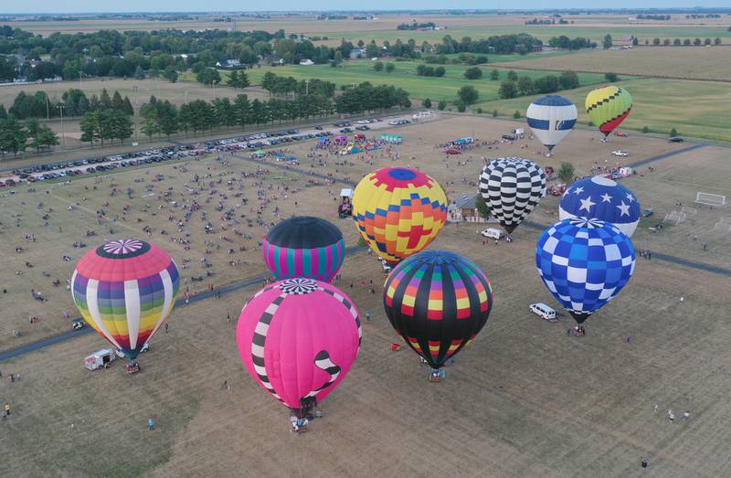 Hot air balloons gather at Zearing Park during the 52nd annual Homestead Festival on Saturday, Sept. 9 2023 in Princeton.