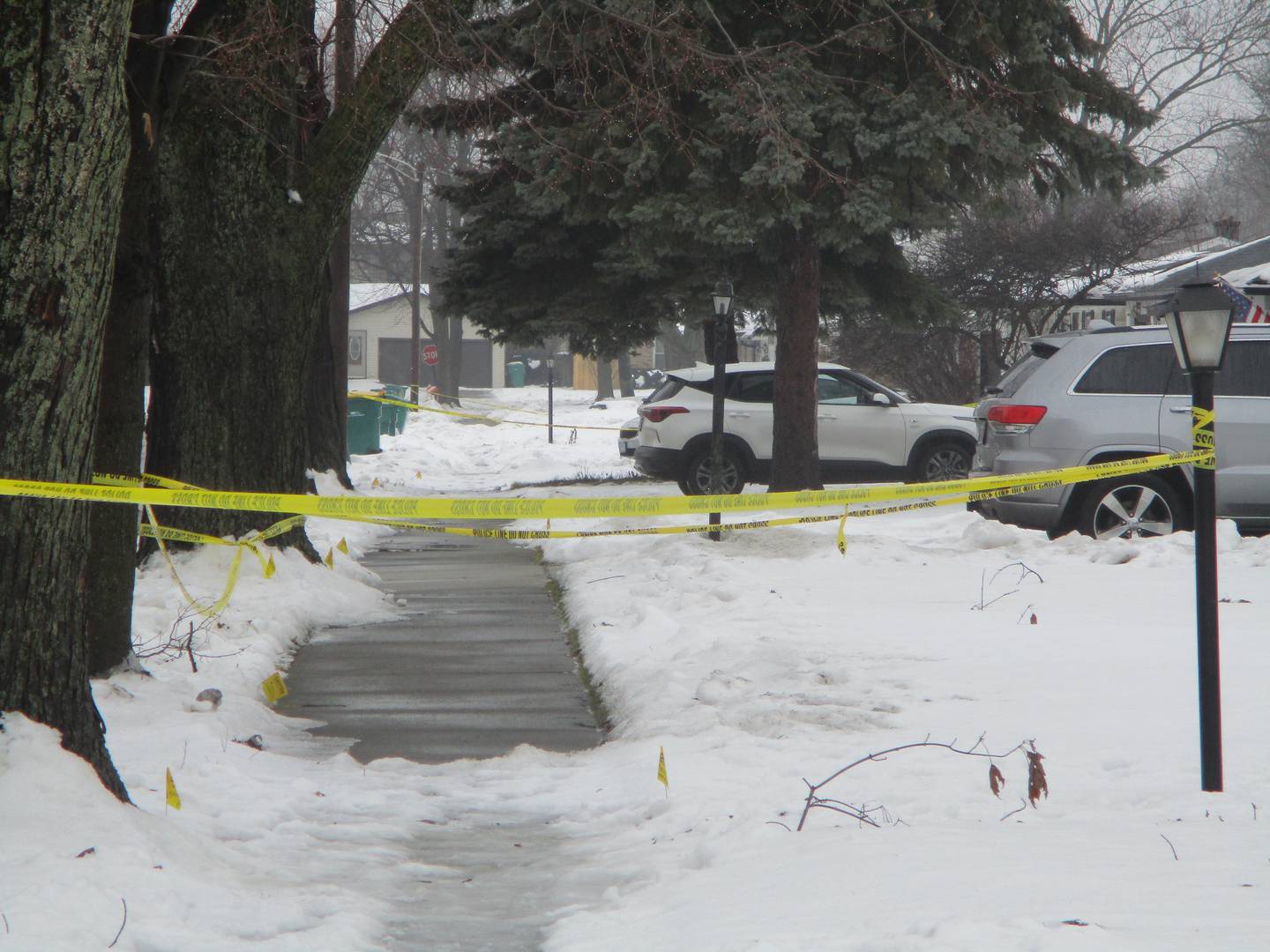 Police tape marks off a sidewalk in the 2200 block of West Acres Road in Joliet. Nov. 23, 2024