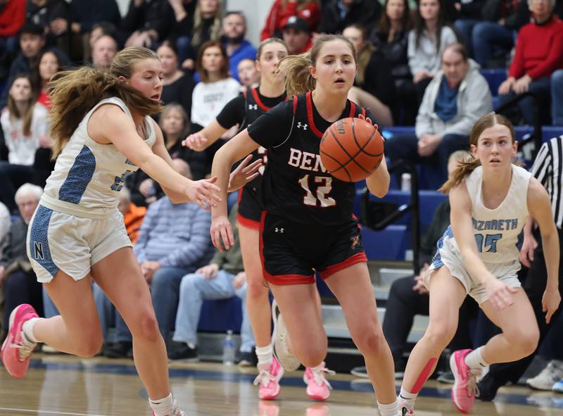 Benet’s Lindsay Harzich (12) handles the ball against Nazareth during a girls varsity basketball game on Monday, Jan. 29, 2024 in La Grange Park, IL.