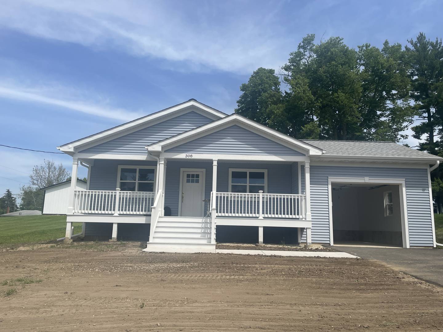 The Gonzalez family home is seen Sunday, May 19, 2024, at 308 Spring St. in Kingston during a house dedication and blessing, put on by Habitat for Humanity of DeKalb County.